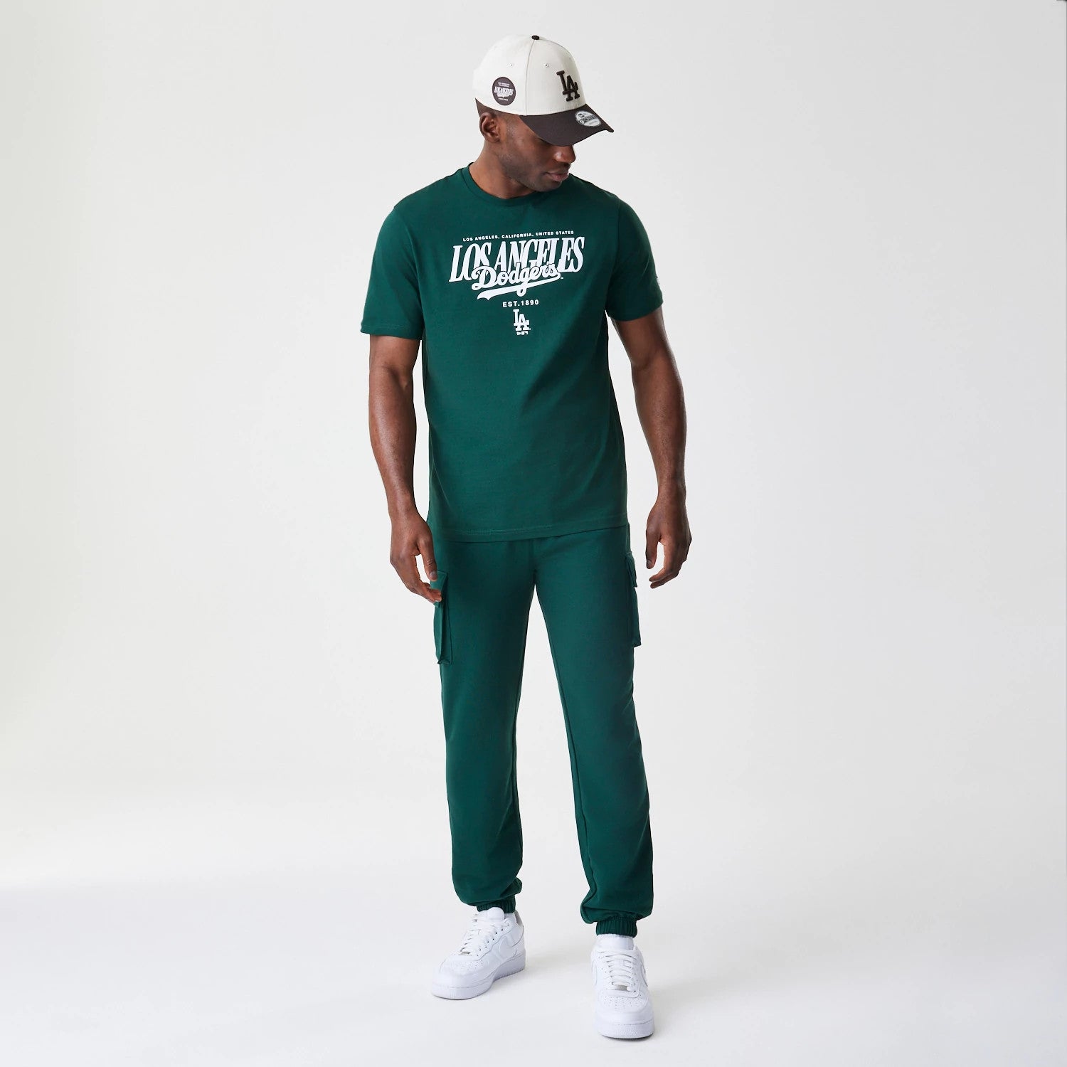 The Male model is wearing  New Era Core Cargo Dark Green Joggers 8
