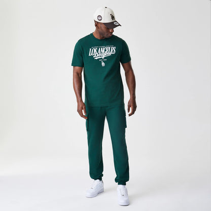 The Male model is wearing  New Era Core Cargo Dark Green Joggers 8