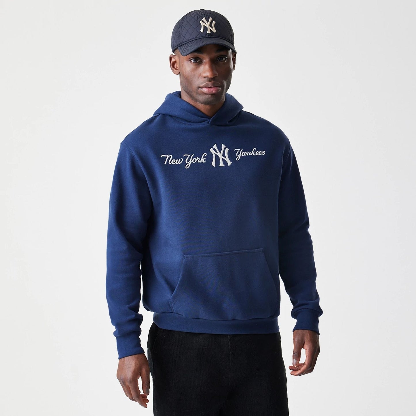 The Male model is wearing New York Yankees MLB Script Navy Oversized Pullover Hoodie  3