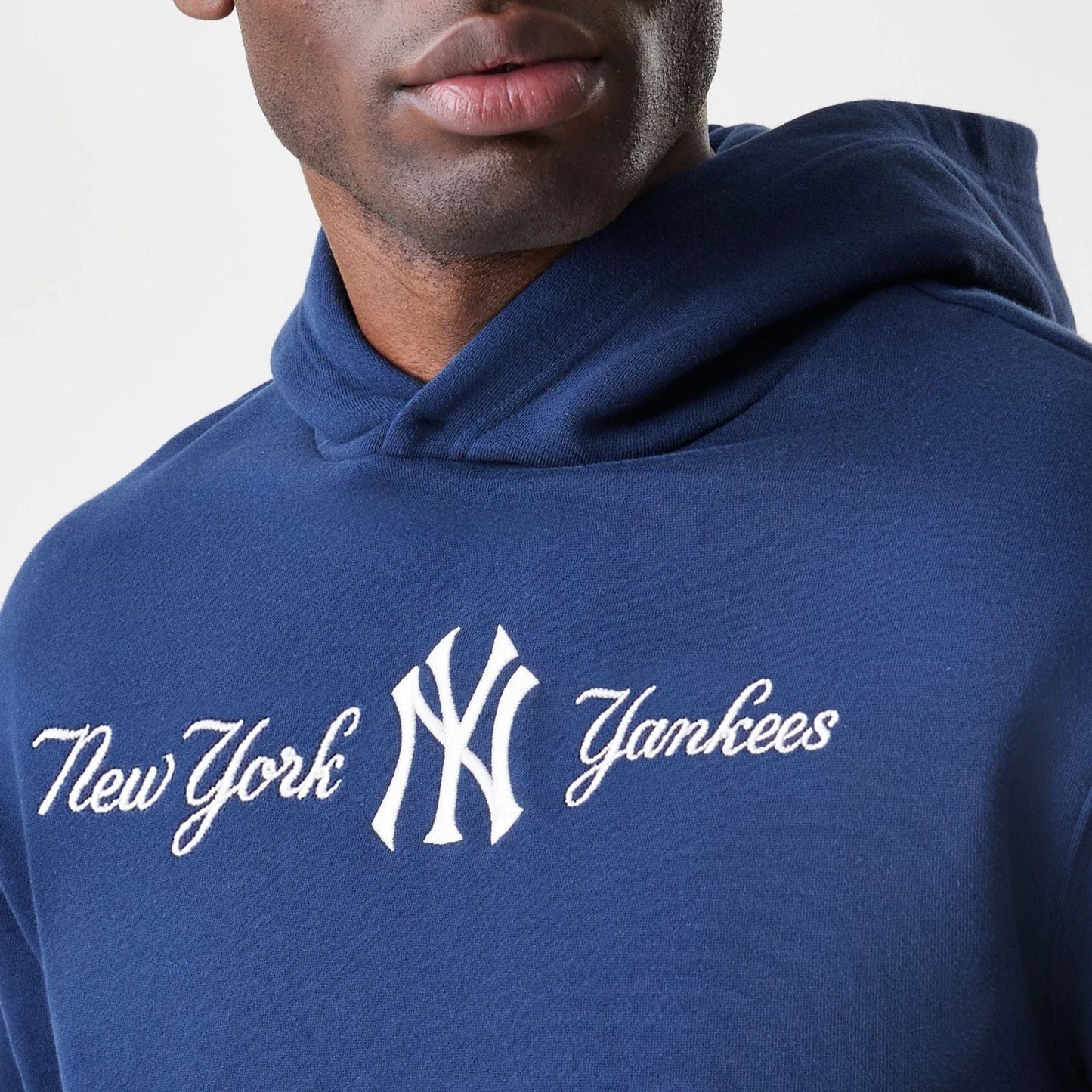 The Male model is wearing New York Yankees MLB Script Navy Oversized Pullover Hoodie  6