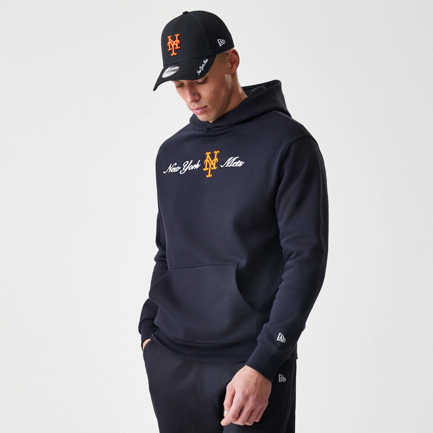 The Male model is wearing New York Mets MLB Script Black Oversized Pullover Hoodie 3