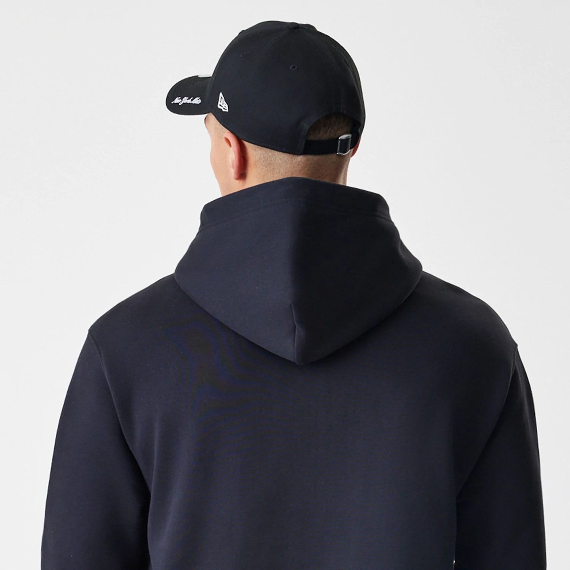 The Male model is wearing New York Mets MLB Script Black Oversized Pullover Hoodie  8