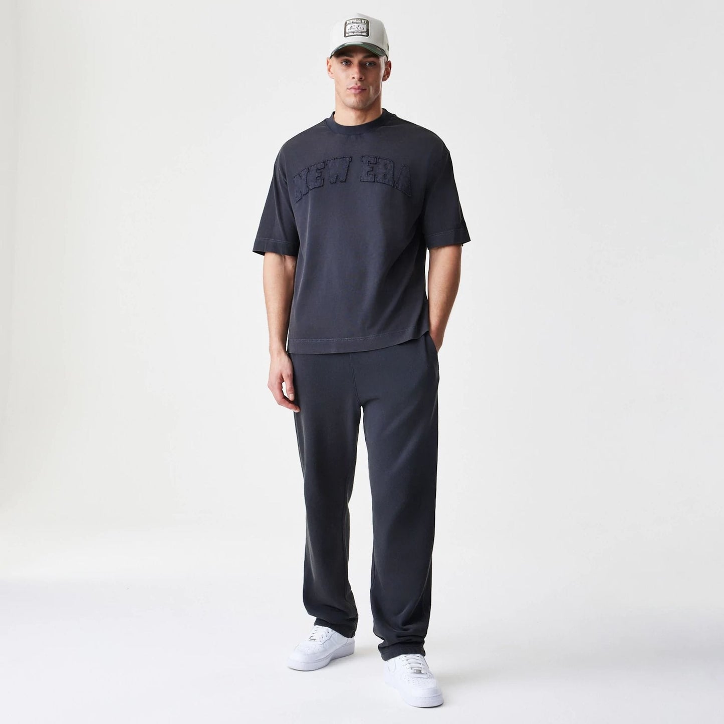 The Male model is wearing  New Era Washed Black Straight Leg Joggers  8