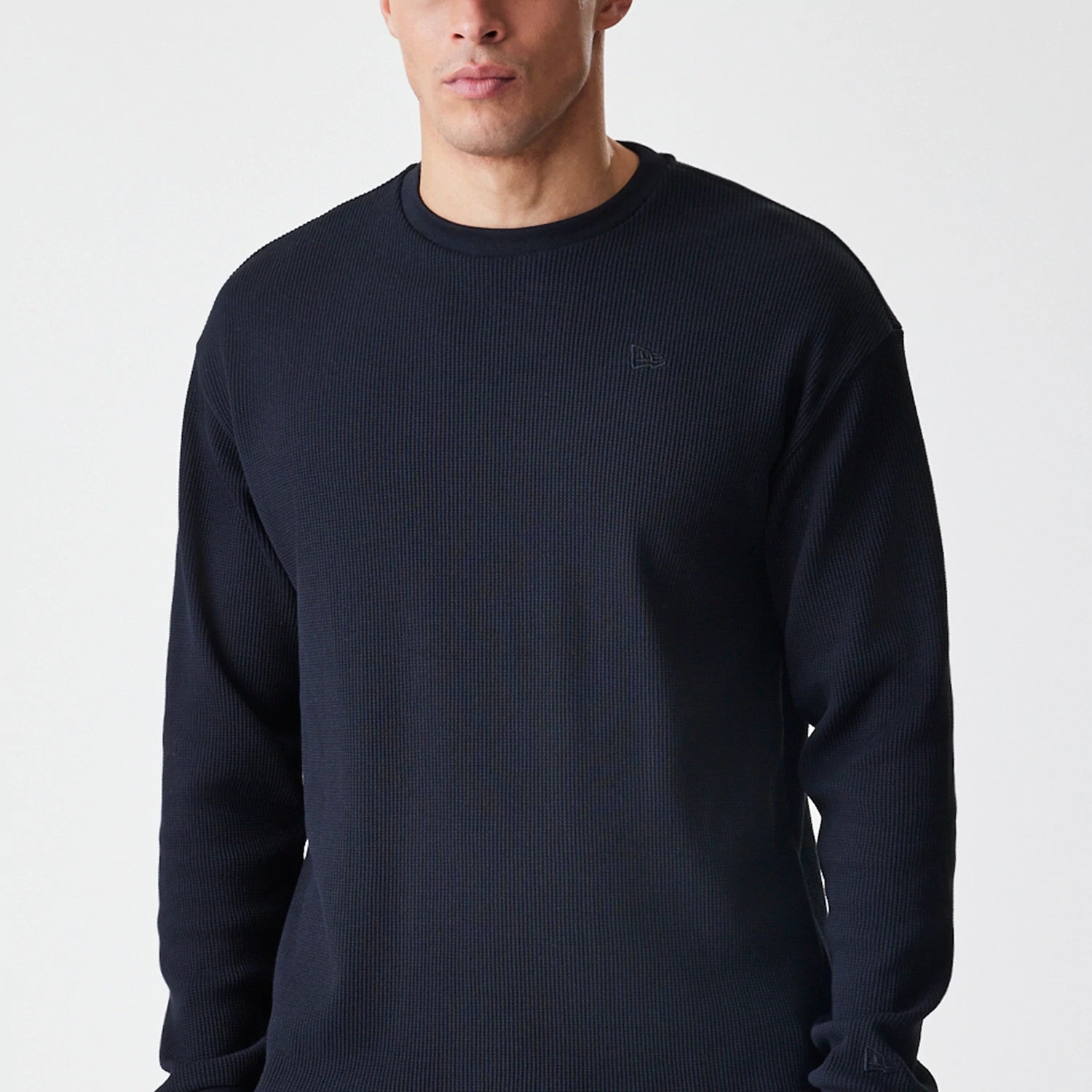 The Male model is wearing  New Era Waffle Black Long Sleeve T-Shirt 3