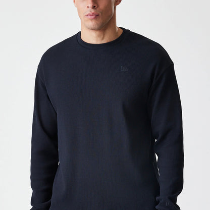 The Male model is wearing  New Era Waffle Black Long Sleeve T-Shirt 3