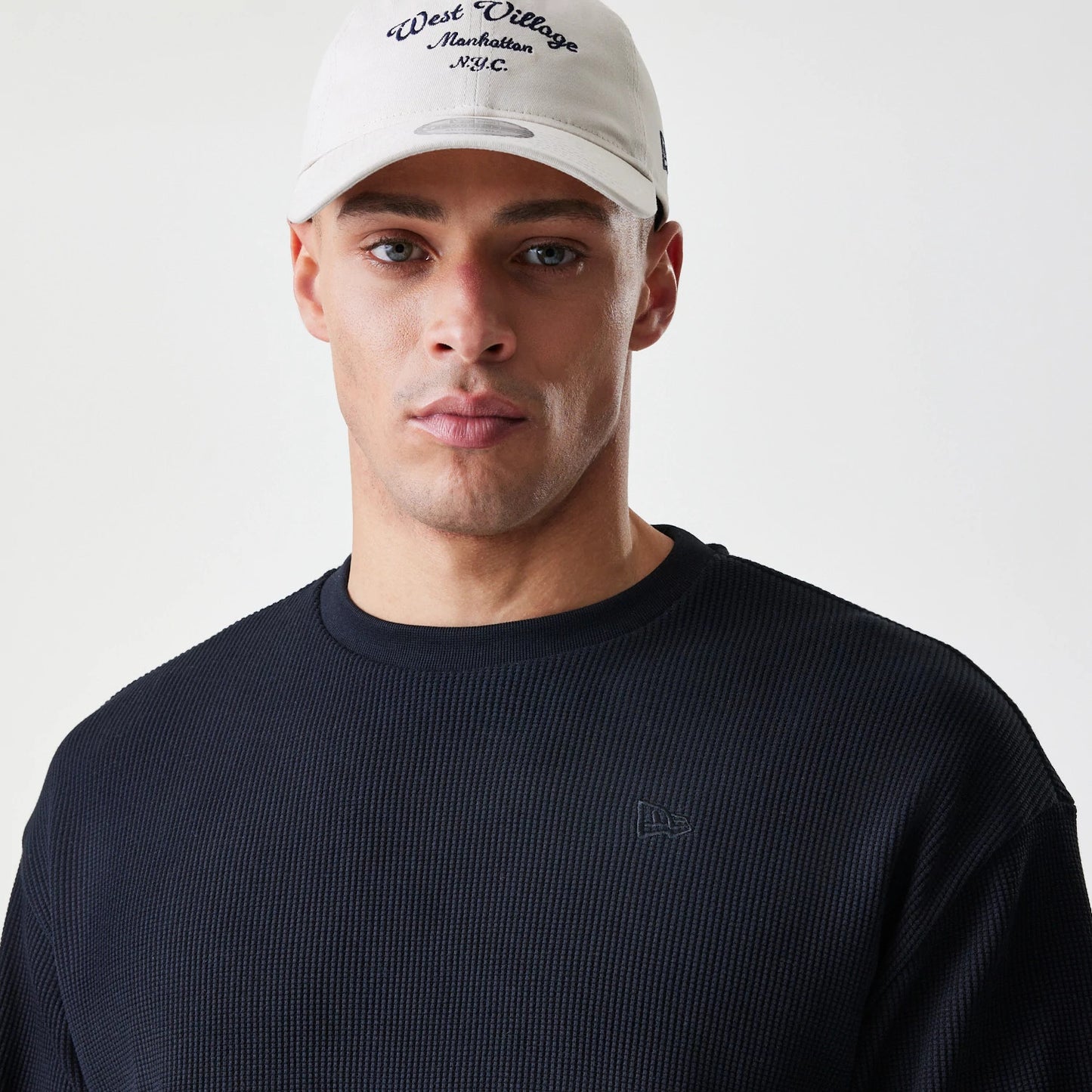 The Male model is wearing  New Era Waffle Black Long Sleeve T-Shirt 4