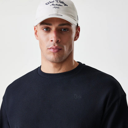 The Male model is wearing  New Era Waffle Black Long Sleeve T-Shirt 4