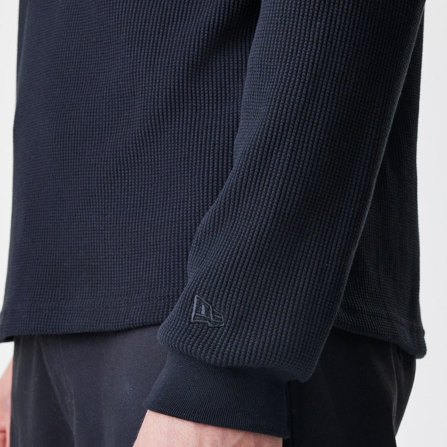 The Male model is wearing  New Era Waffle Black Long Sleeve T-Shirt  5