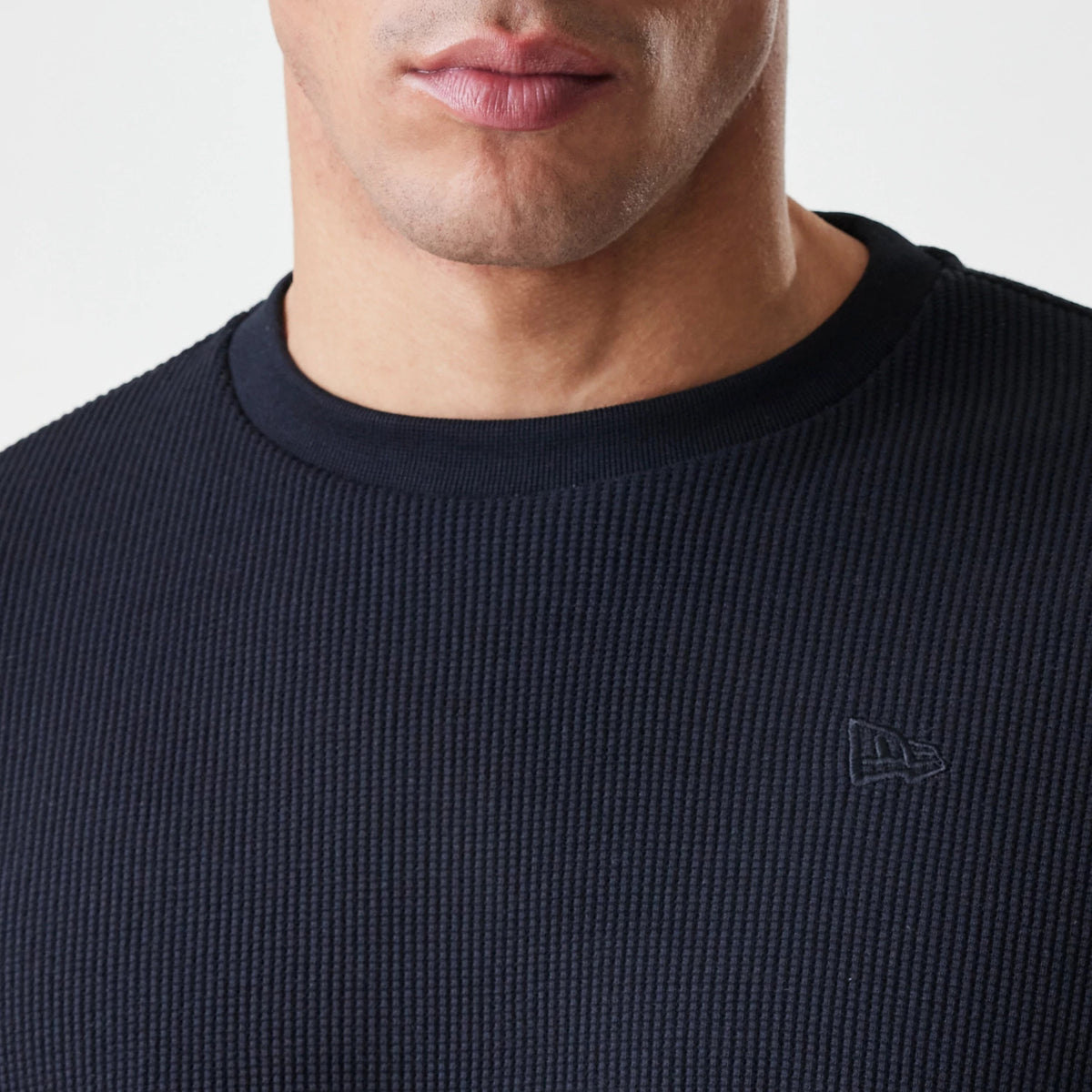 The Male model is wearing  New Era Waffle Black Long Sleeve T-Shirt 6
