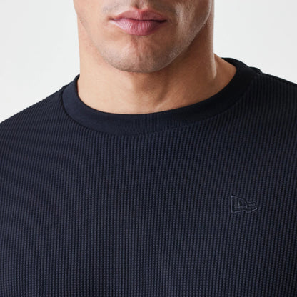 The Male model is wearing  New Era Waffle Black Long Sleeve T-Shirt 6