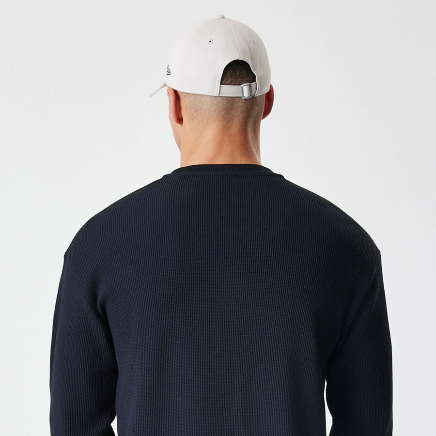 The Male model is wearing  New Era Waffle Black Long Sleeve T-Shirt  7