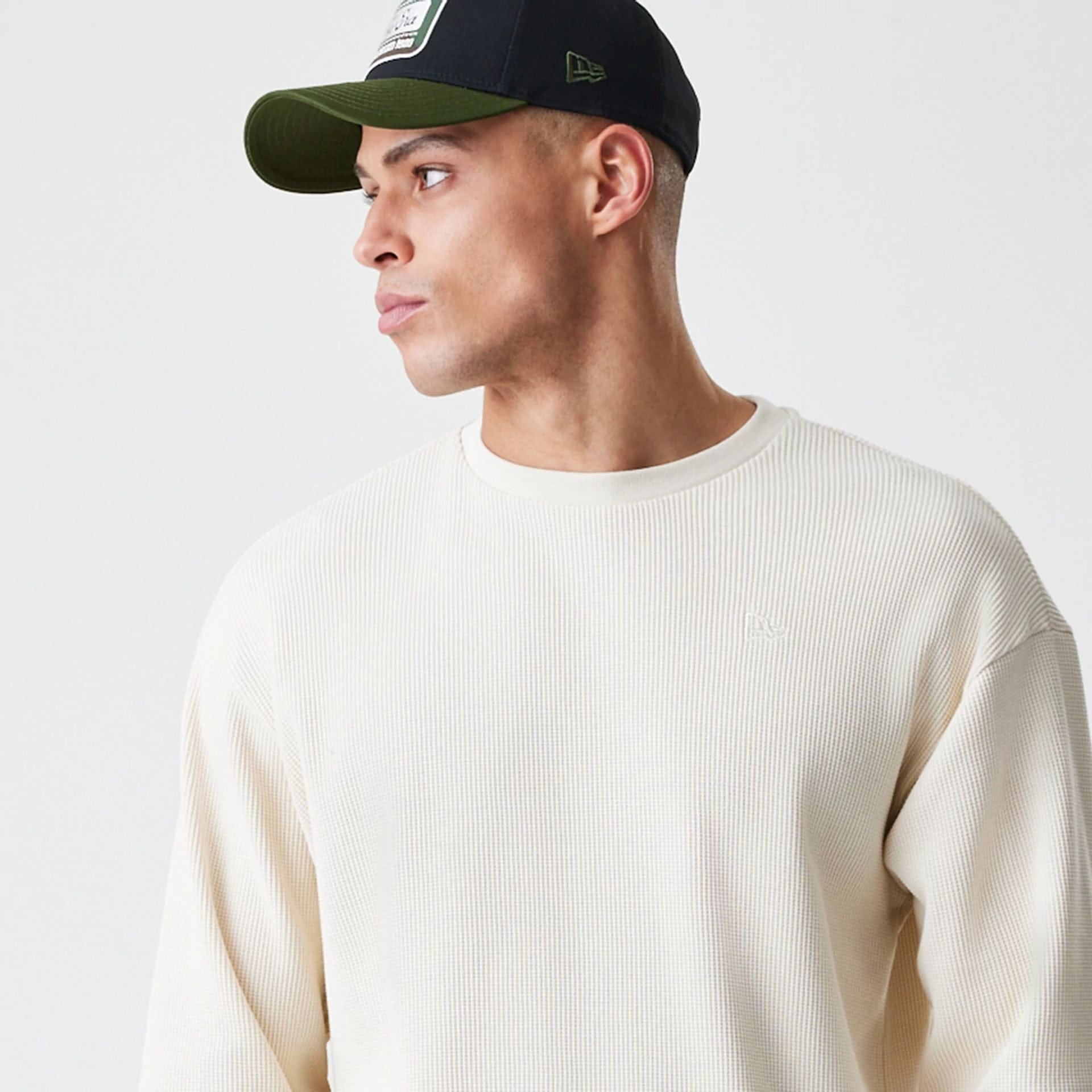 The Male model is wearing  New Era Waffle Light Beige Long Sleeve T-Shirt  4