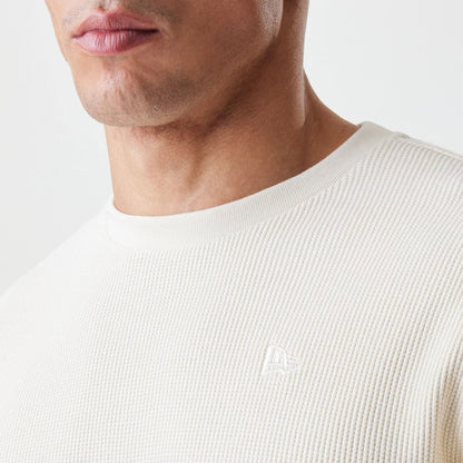 The Male model is wearing  New Era Waffle Light Beige Long Sleeve T-Shirt  6