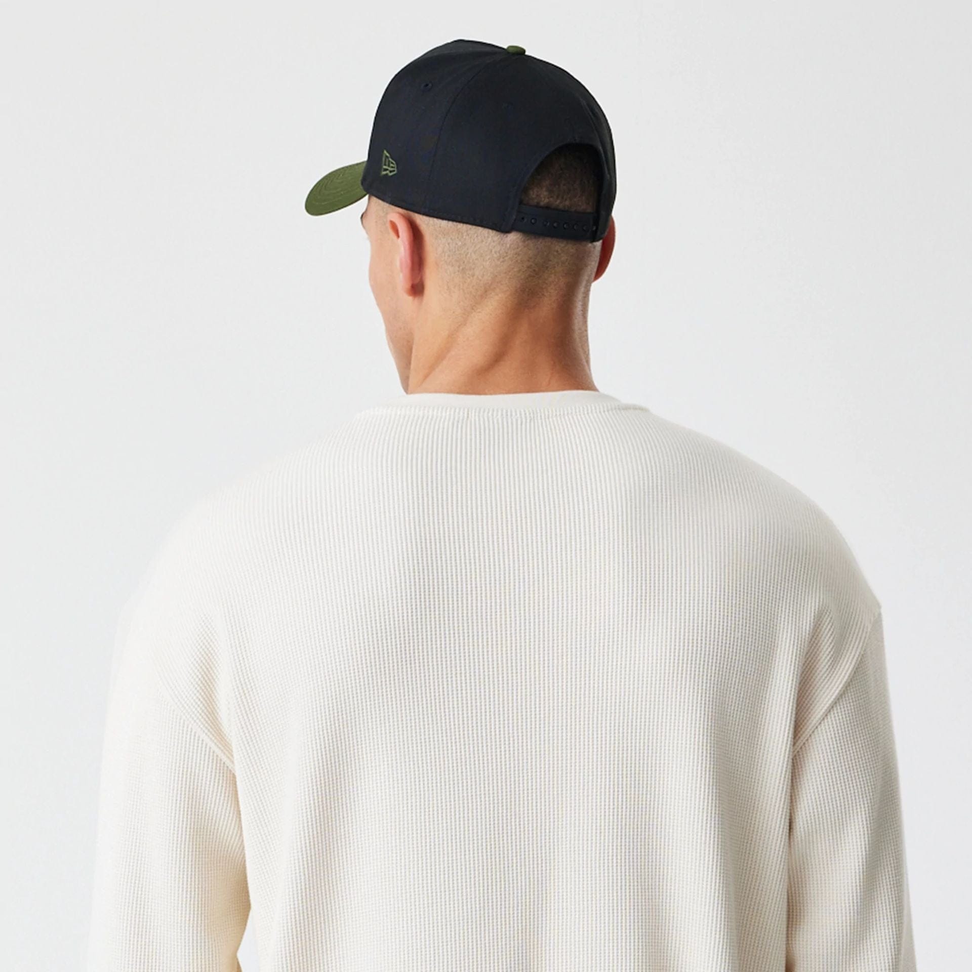 The Male model is wearing  New Era Waffle Light Beige Long Sleeve T-Shirt  7