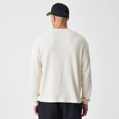 The Male model is wearing  New Era Waffle Light Beige Long Sleeve T-Shirt 2