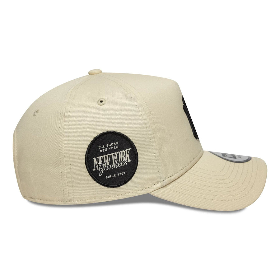 This is a New York Yankees MLB Sidepatch Light Beige 9FORTY E-Frame Adjustable Cap 5