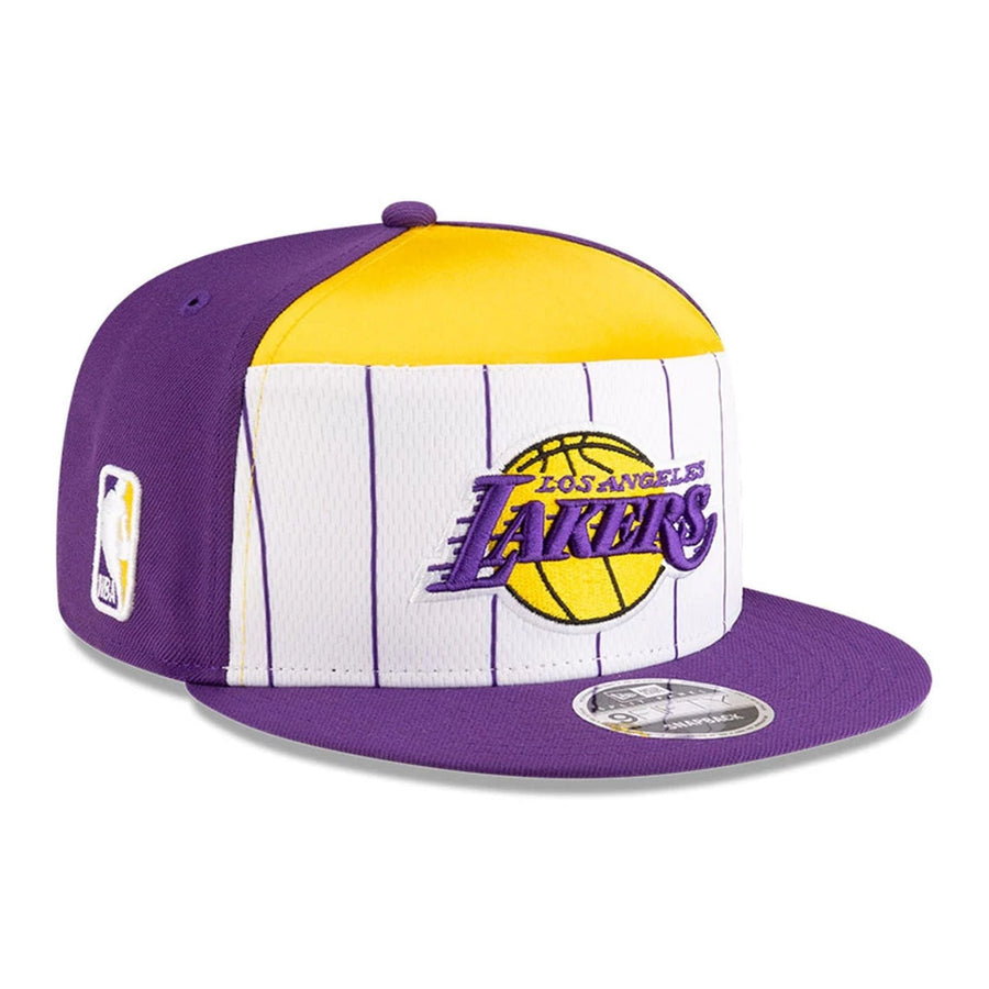 This is a LA Lakers NBA Tip Off 2025 Purple 9FIFTY Split Panel Snapback Adjustable Cap 1