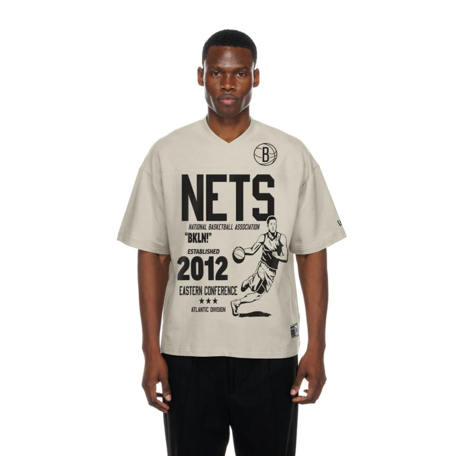 The Male model is wearing Brooklyn Nets NBA Throwback Prep Light Beige T-Shirt  1