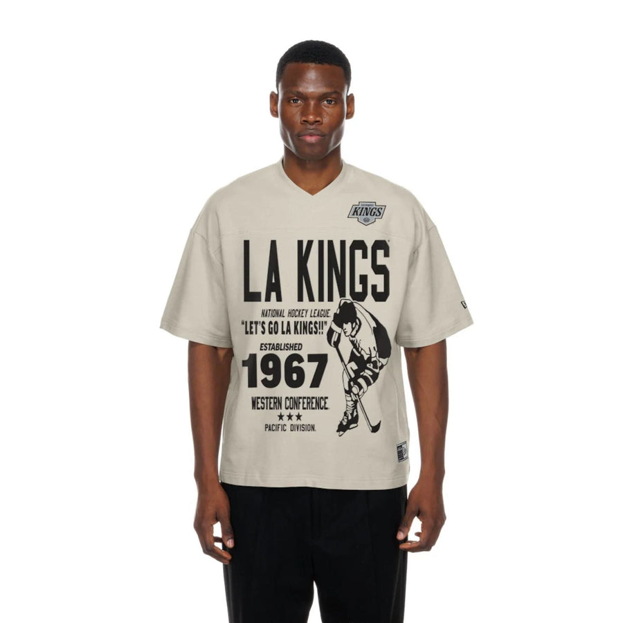 The Male model is wearing LA Kings NHL Throwback Prep Light Beige T-Shirt  1