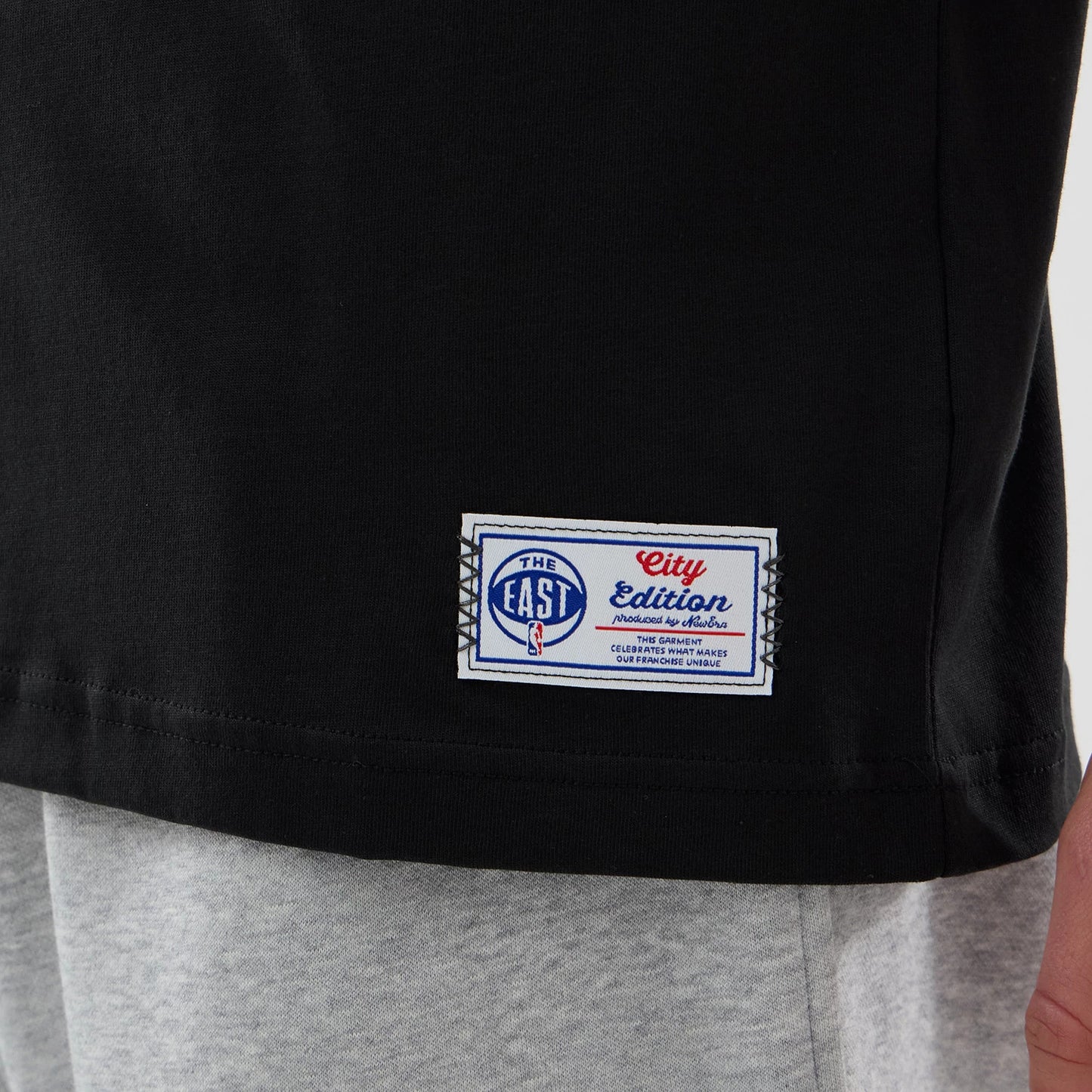 The Male model is wearing Brooklyn Nets NBA City Edition Black T-Shirt 5