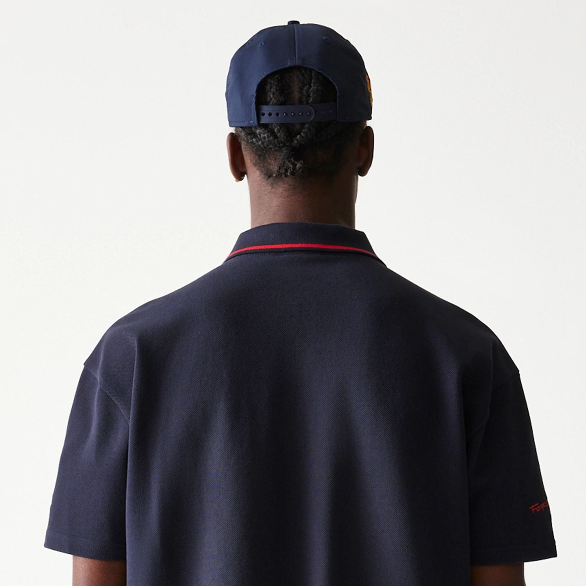 The Male model is wearing Red Bull Racing Dark Blue Polo T-Shirt 7