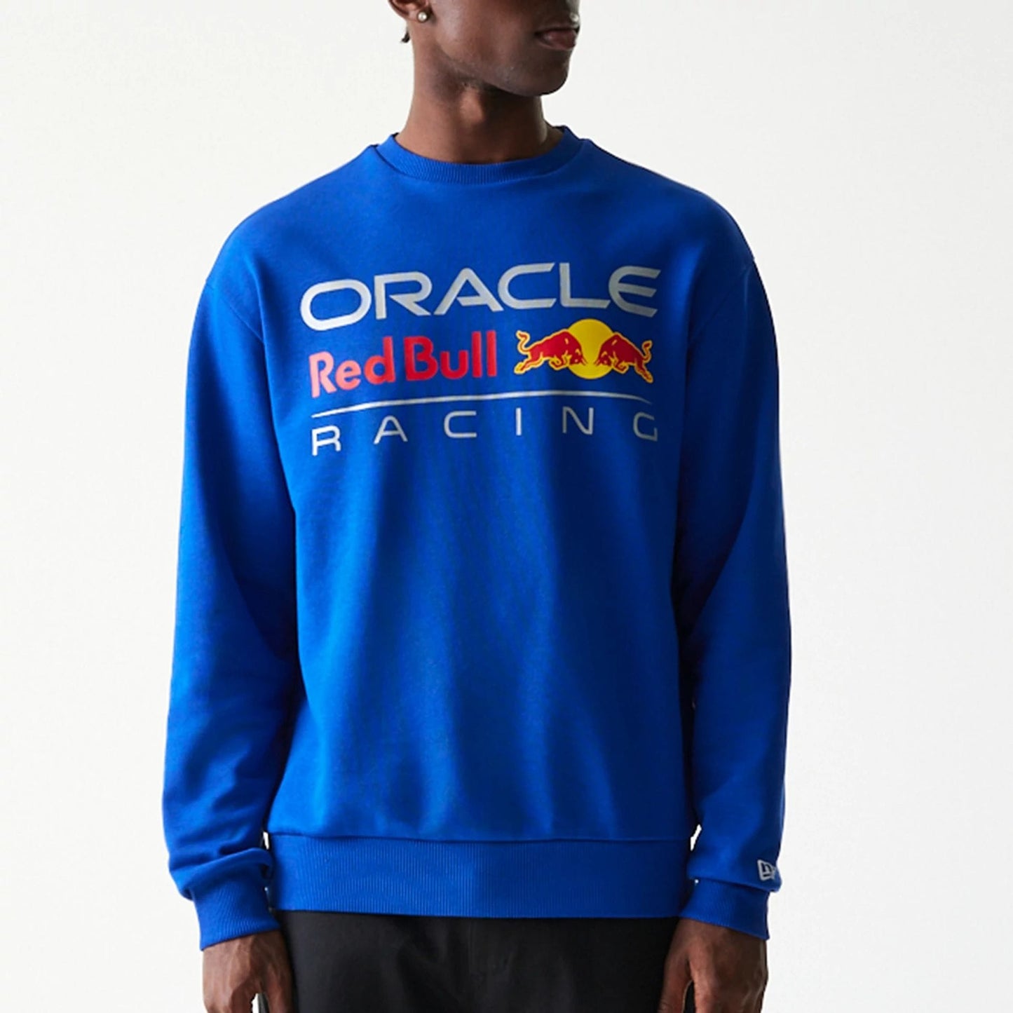 The Male model is wearing Red Bull Racing Blue Oversized Crew Neck Sweater 3
