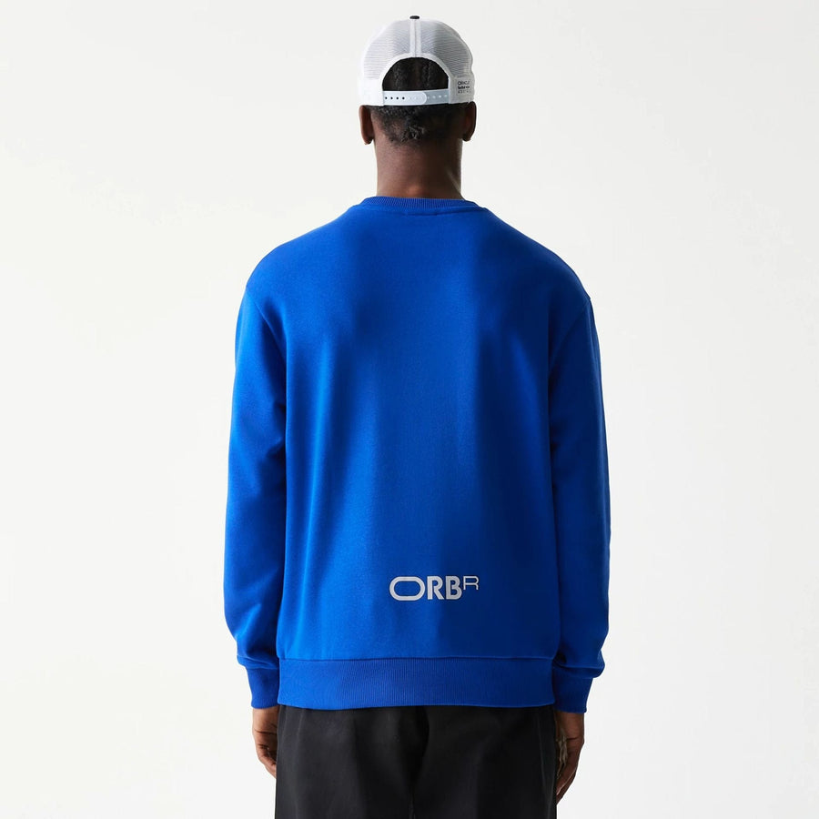 The Male model is wearing Red Bull Racing Blue Oversized Crew Neck Sweater 2