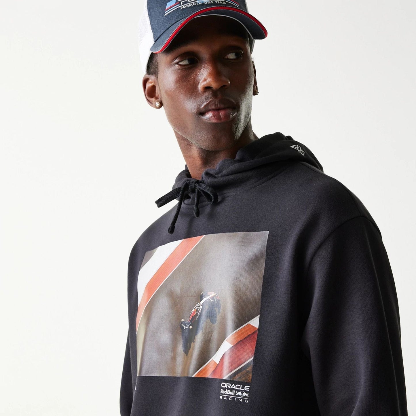 The Male model is wearing Red Bull Racing Black Oversized Pullover Hoodie 3