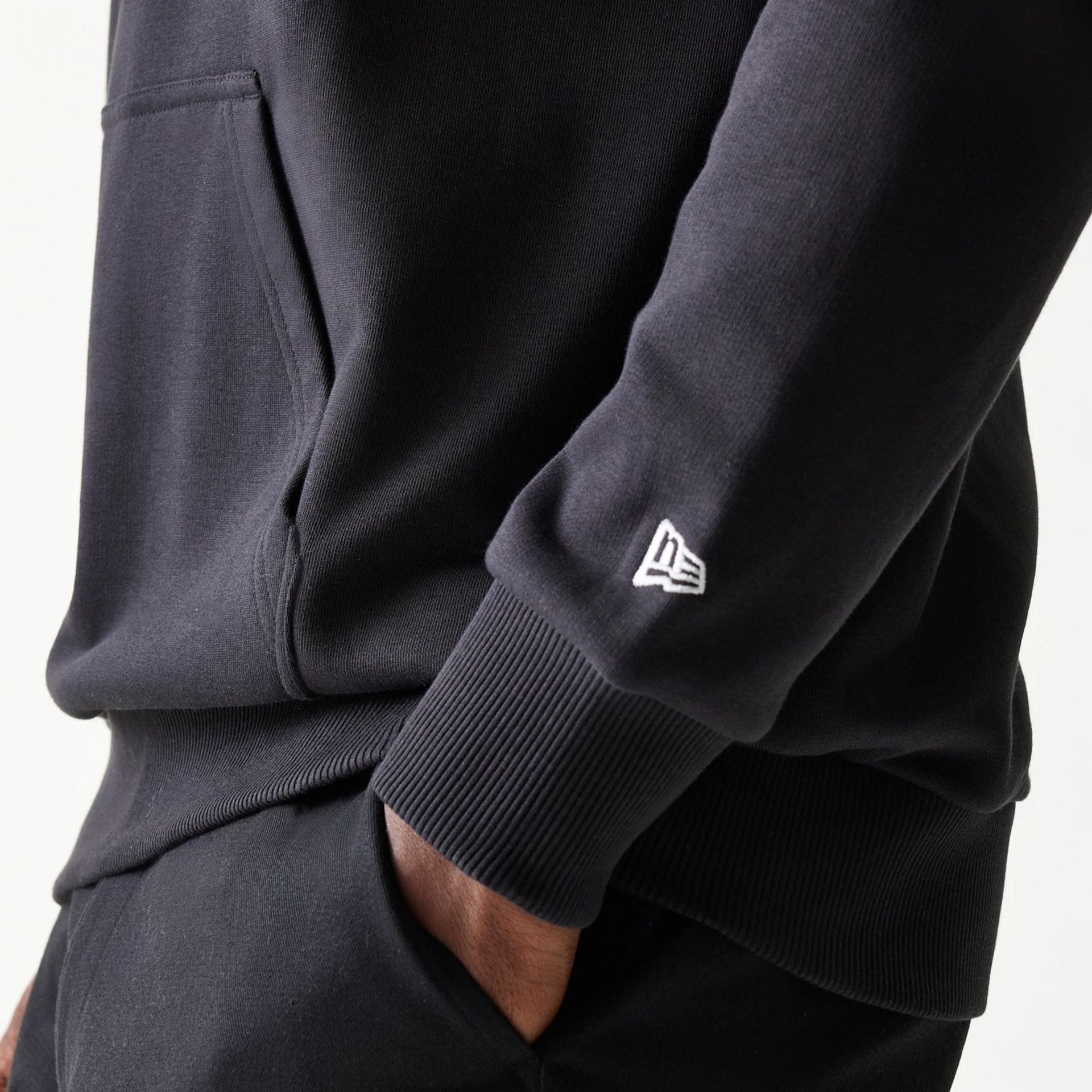 The Male model is wearing Red Bull Racing Black Oversized Pullover Hoodie 4