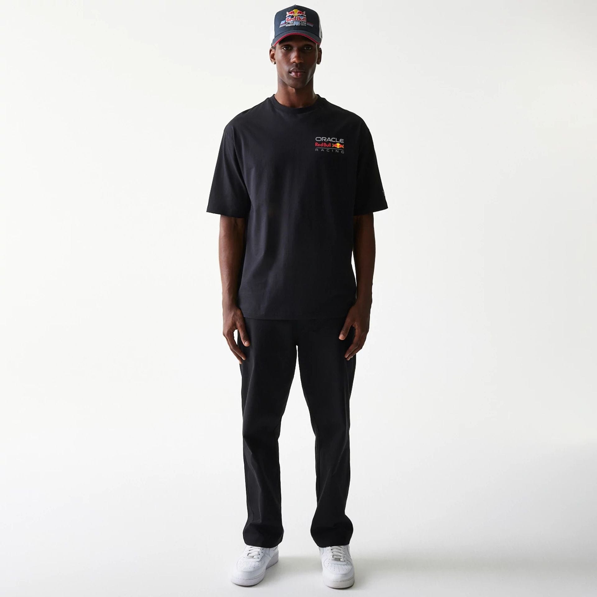 The Male model is wearing Red Bull Racing Black Oversized T-Shirt 8