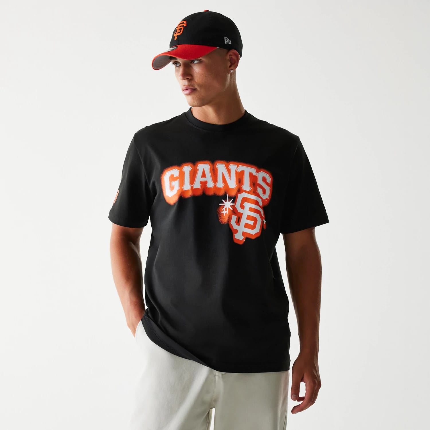 The Male model is wearing San Francisco Giants OVO x MLB Black T-Shirt 1