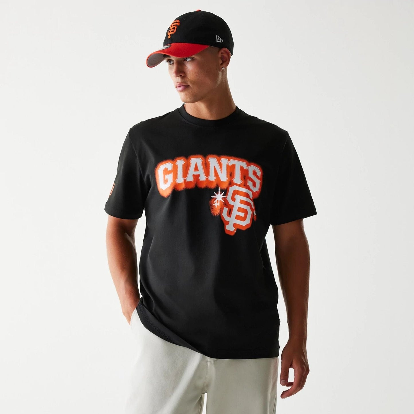 The Male model is wearing San Francisco Giants OVO x MLB Black T-Shirt 1