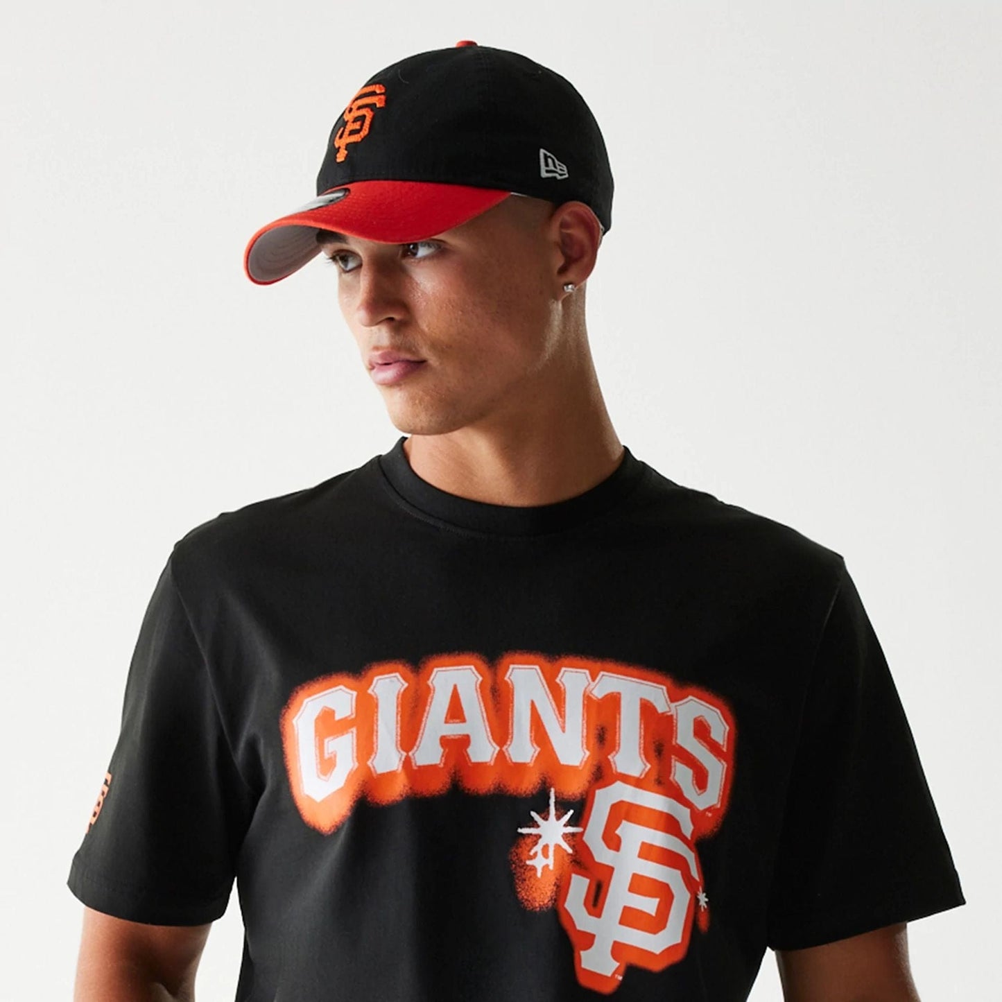 The Male model is wearing San Francisco Giants OVO x MLB Black T-Shirt 6
