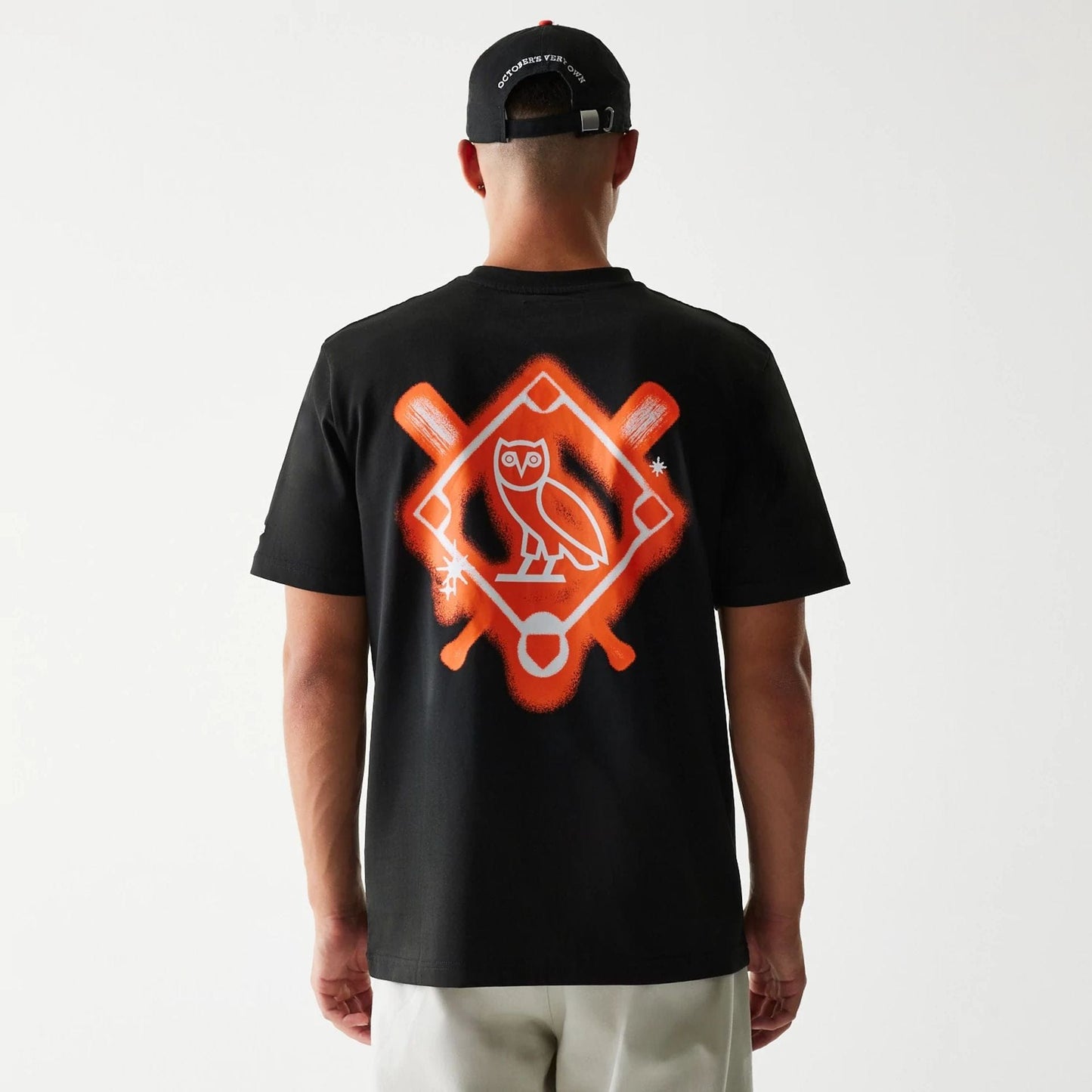 The Male model is wearing San Francisco Giants OVO x MLB Black T-Shirt 2