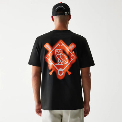 The Male model is wearing San Francisco Giants OVO x MLB Black T-Shirt 2