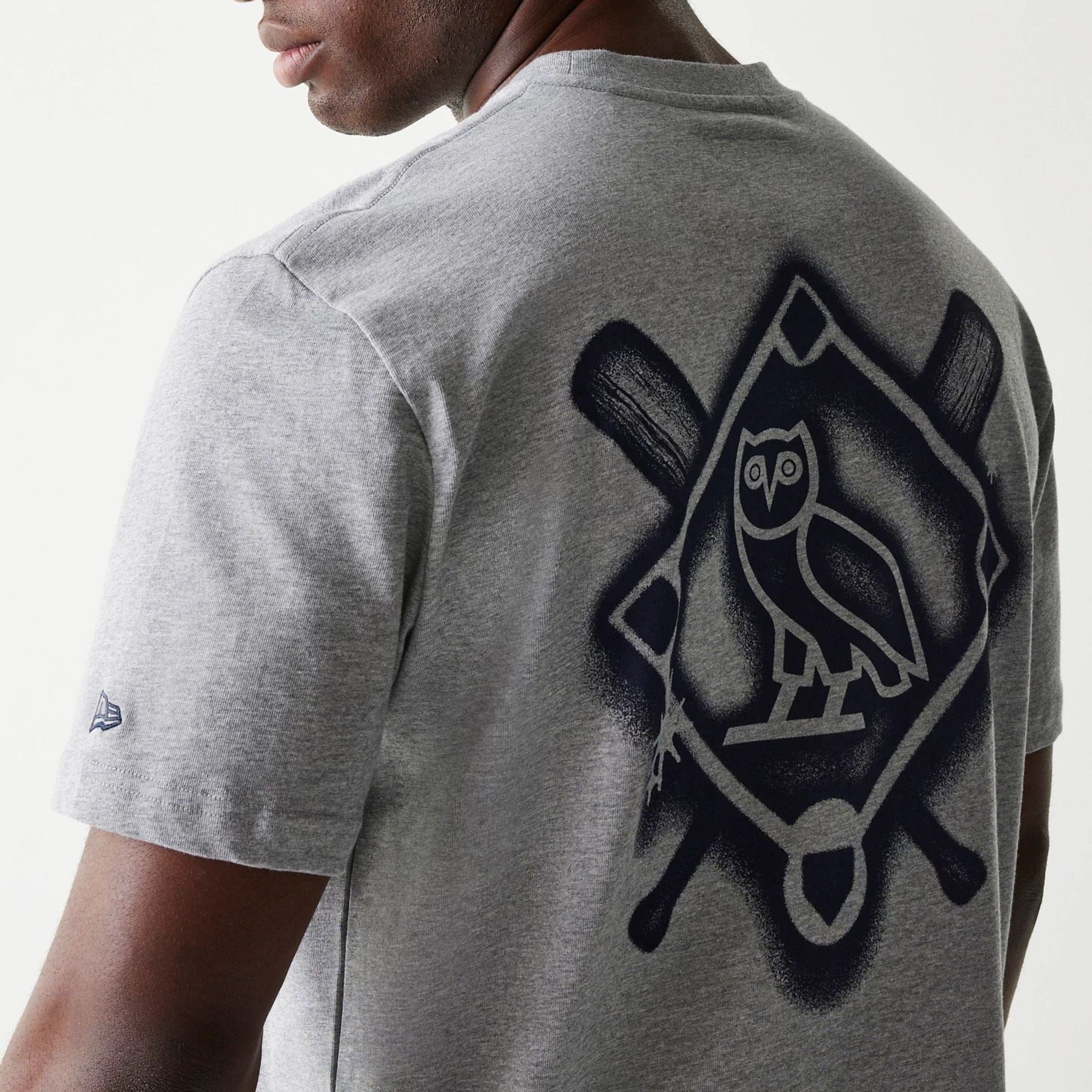The Male model is wearing New York Yankees OVO x MLB Grey T-Shirt 5
