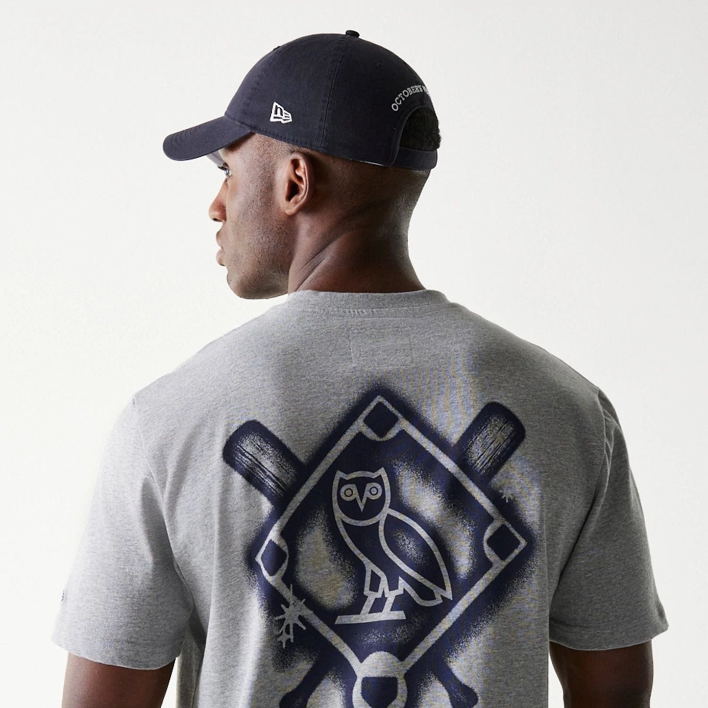 The Male model is wearing New York Yankees OVO x MLB Grey T-Shirt 7