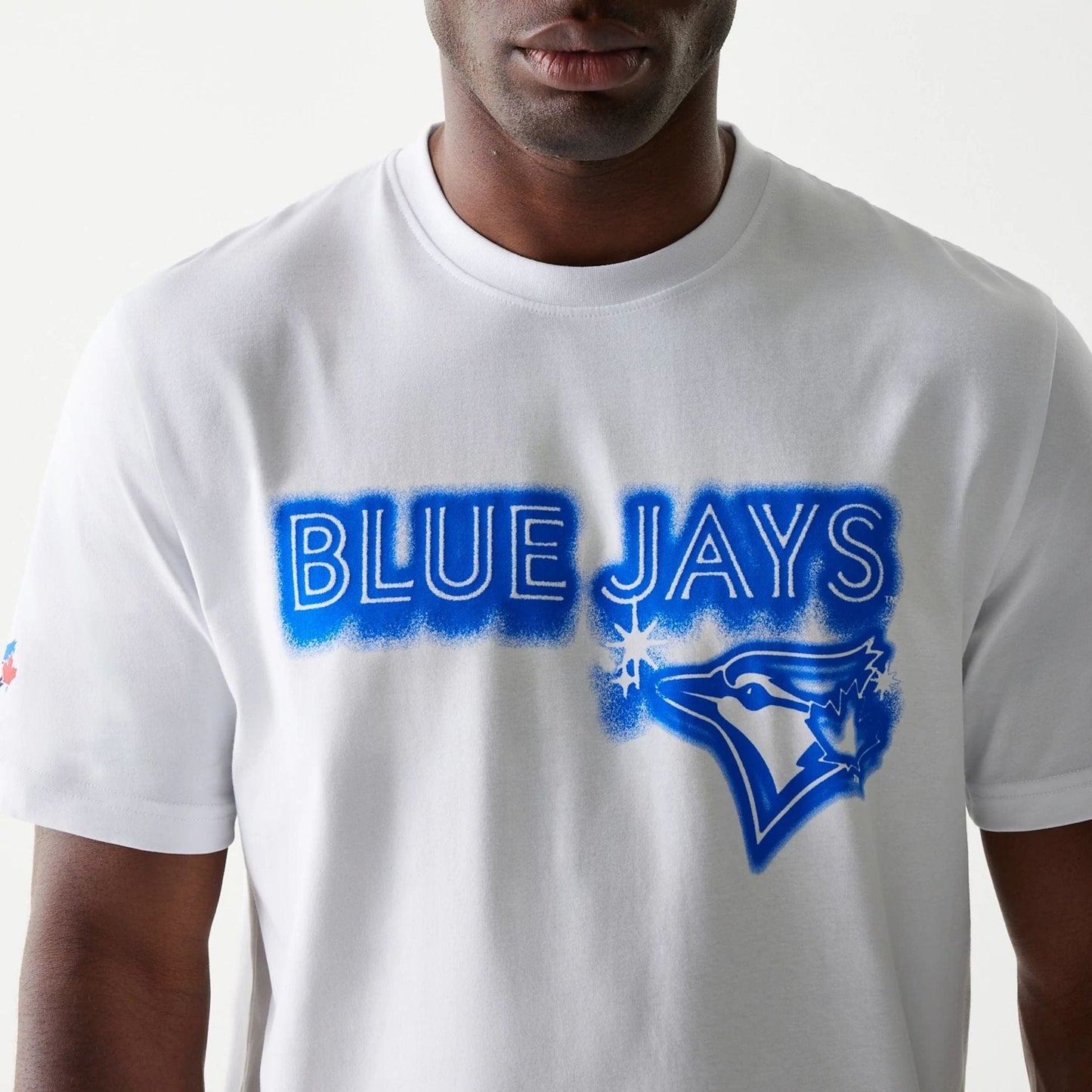The Male model is wearing Toronto Blue Jays OVO x MLB White T-Shirt 6