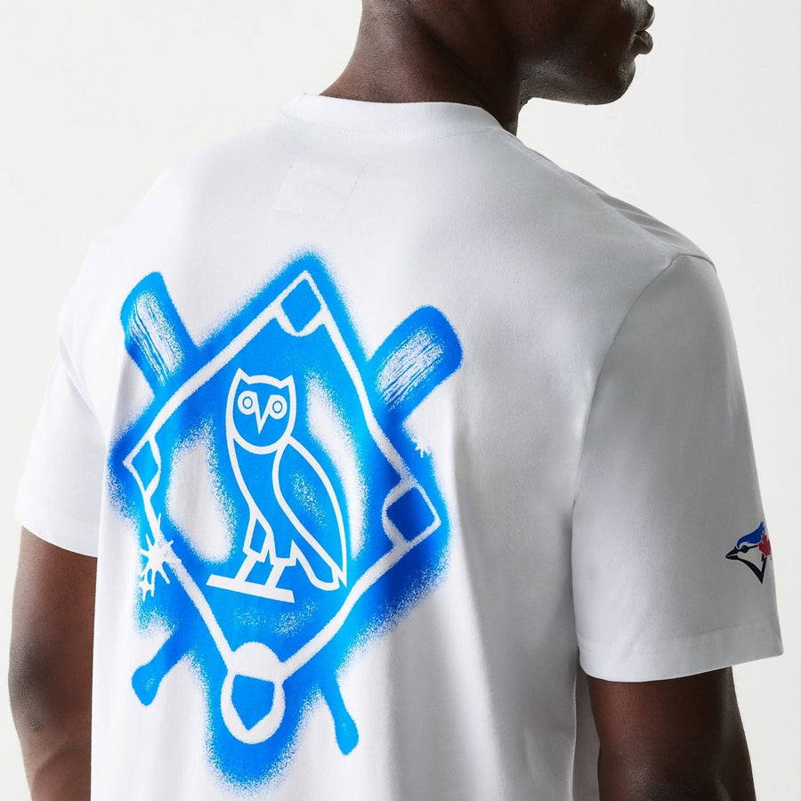 The Male model is wearing Toronto Blue Jays OVO x MLB White T-Shirt 4