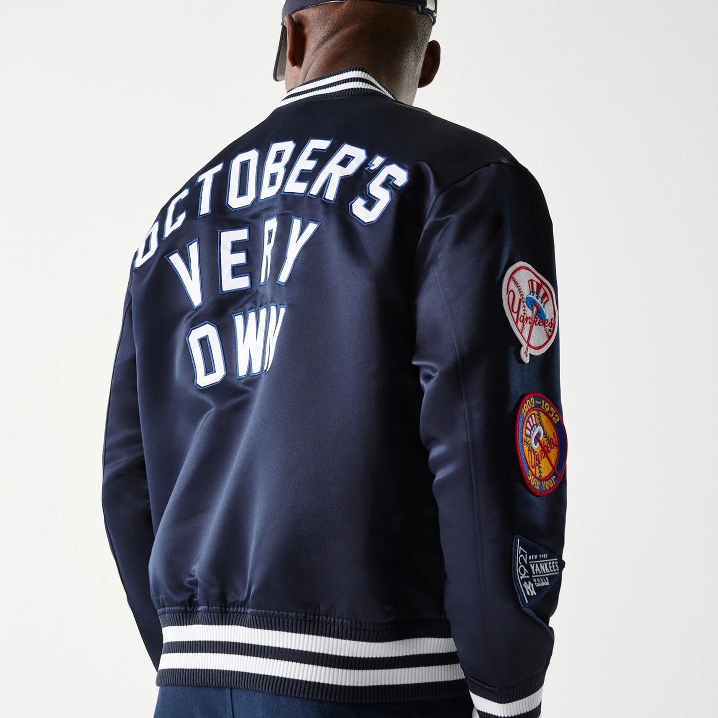 The Male model is wearing New York Yankees OVO x MLB Navy Jacket 6