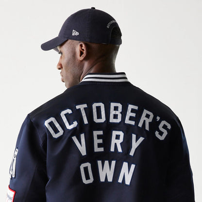 The Male model is wearing New York Yankees OVO x MLB Navy Jacket 7