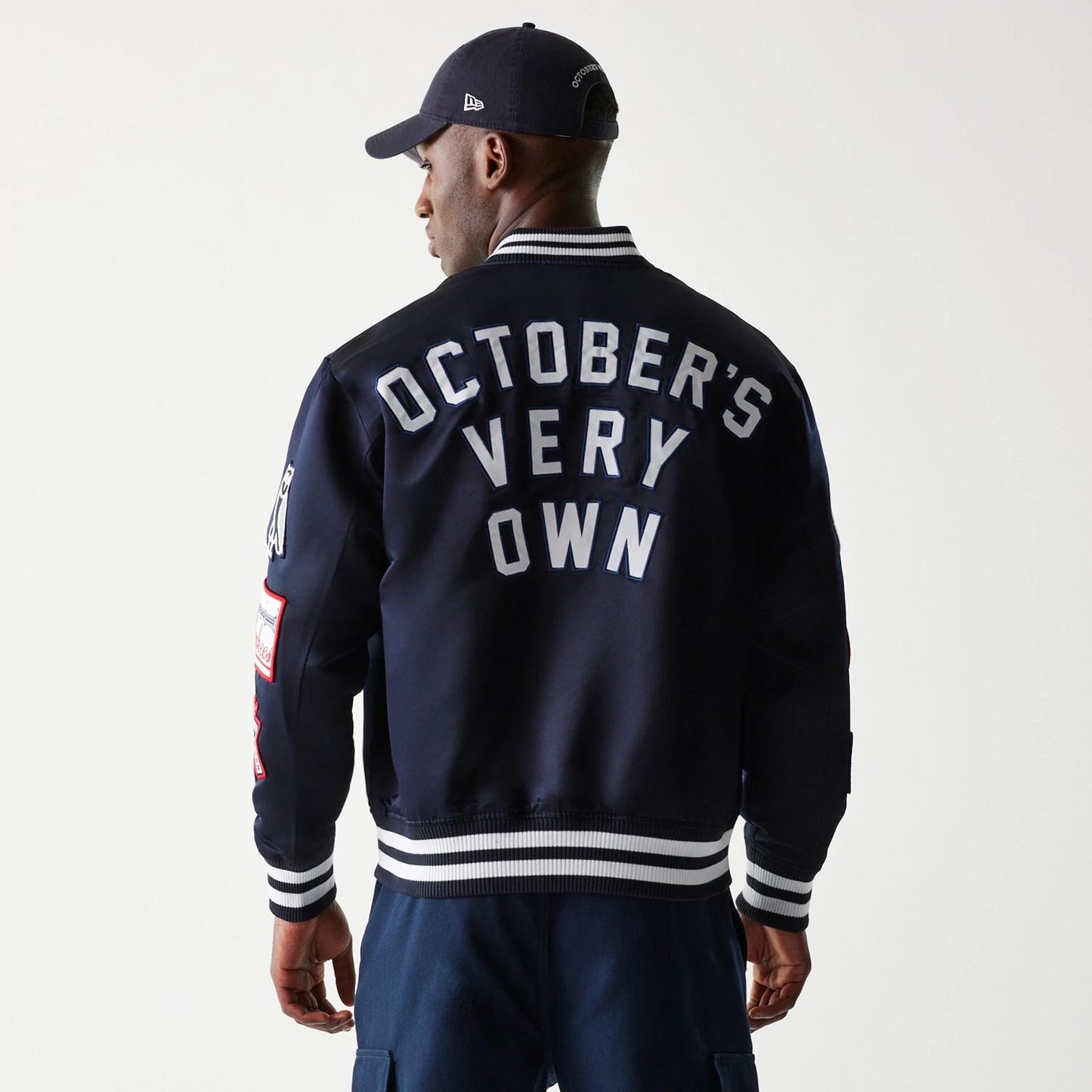 The Male model is wearing New York Yankees OVO x MLB Navy Jacket 2