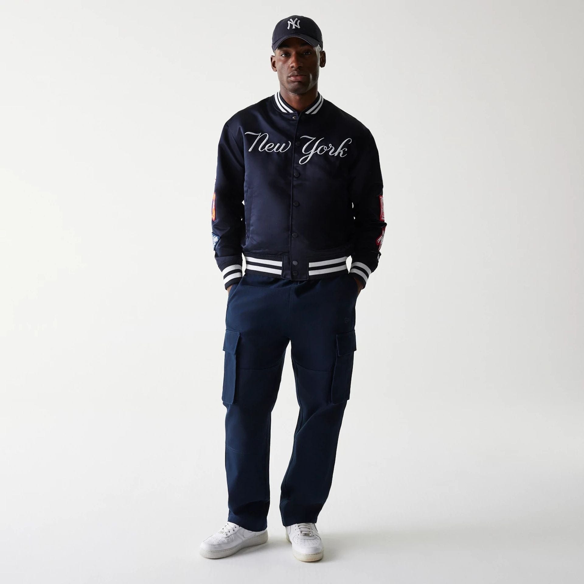 The Male model is wearing New York Yankees OVO x MLB Navy Jacket 8