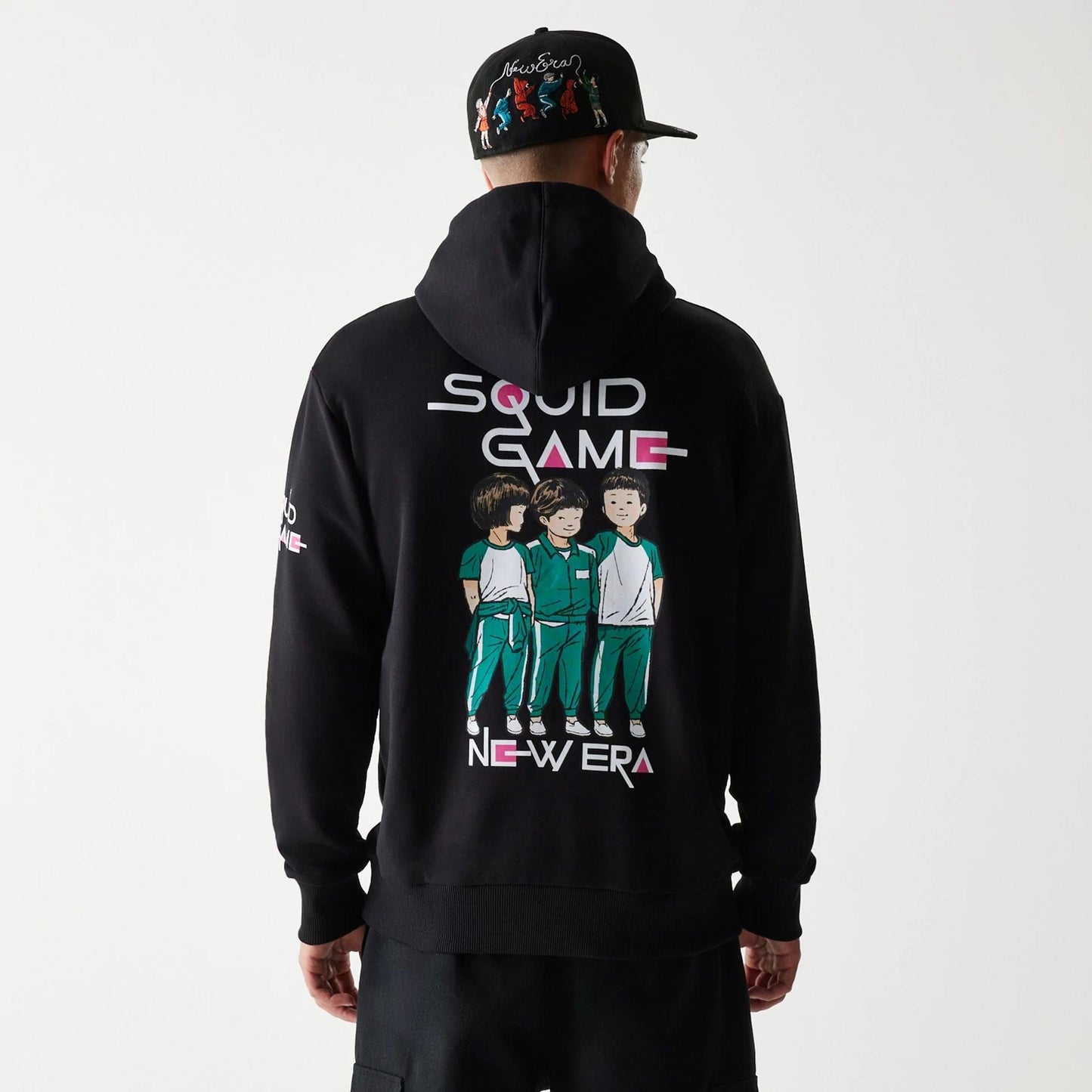 The Male model is wearing Netflix Squid Game Black Oversized Pullover Hoodie 2