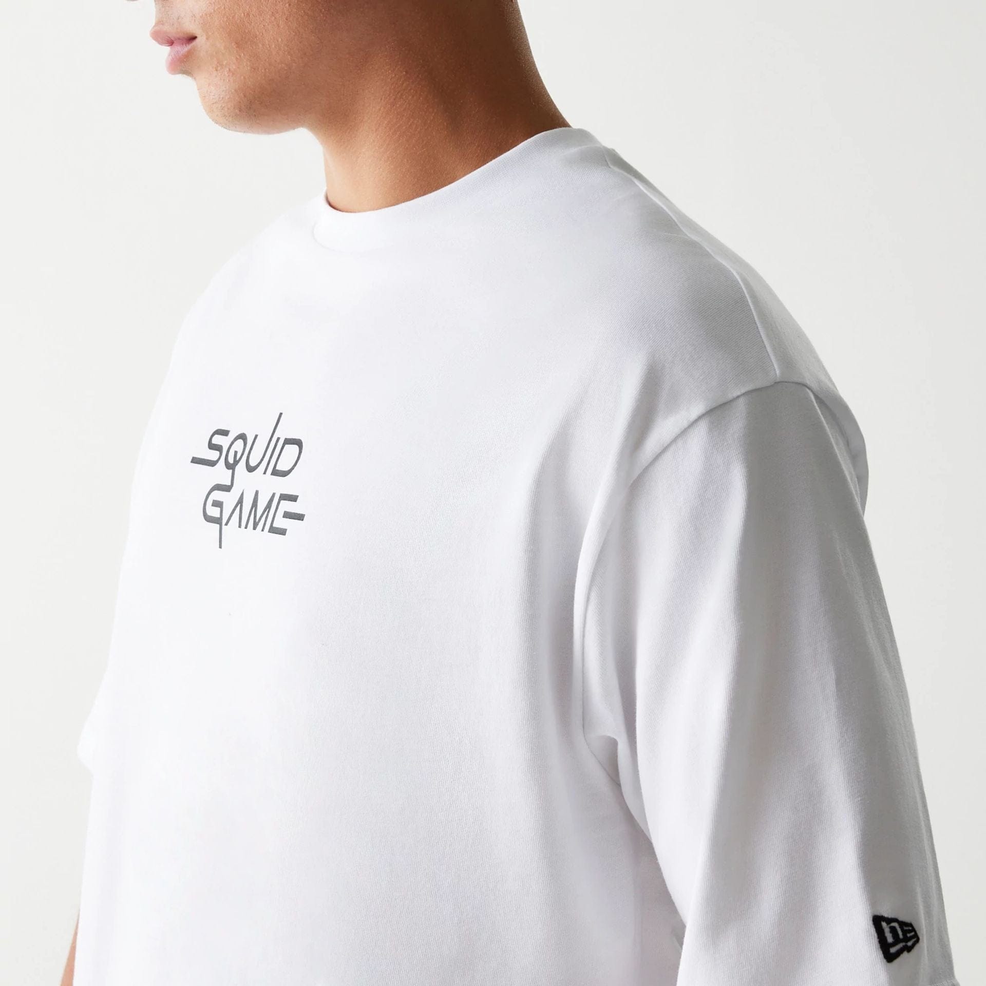 The Male model is wearing Netflix Squid Game White Oversized T-Shirt 5
