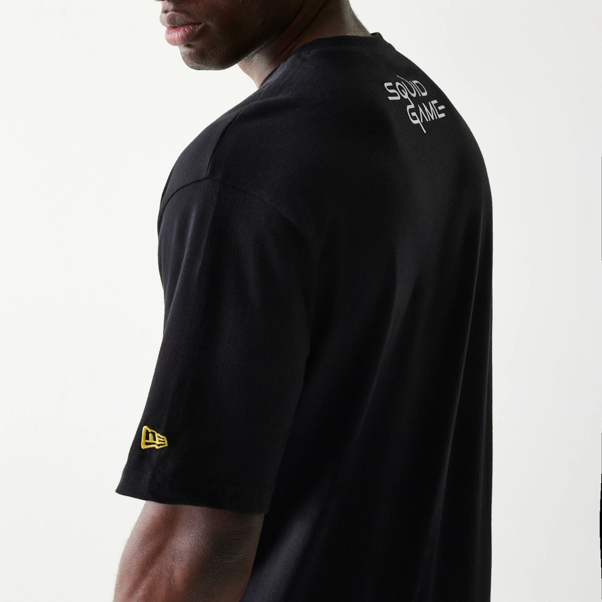 The Male model is wearing Netflix Squid Game Black Oversized T-Shirt 6