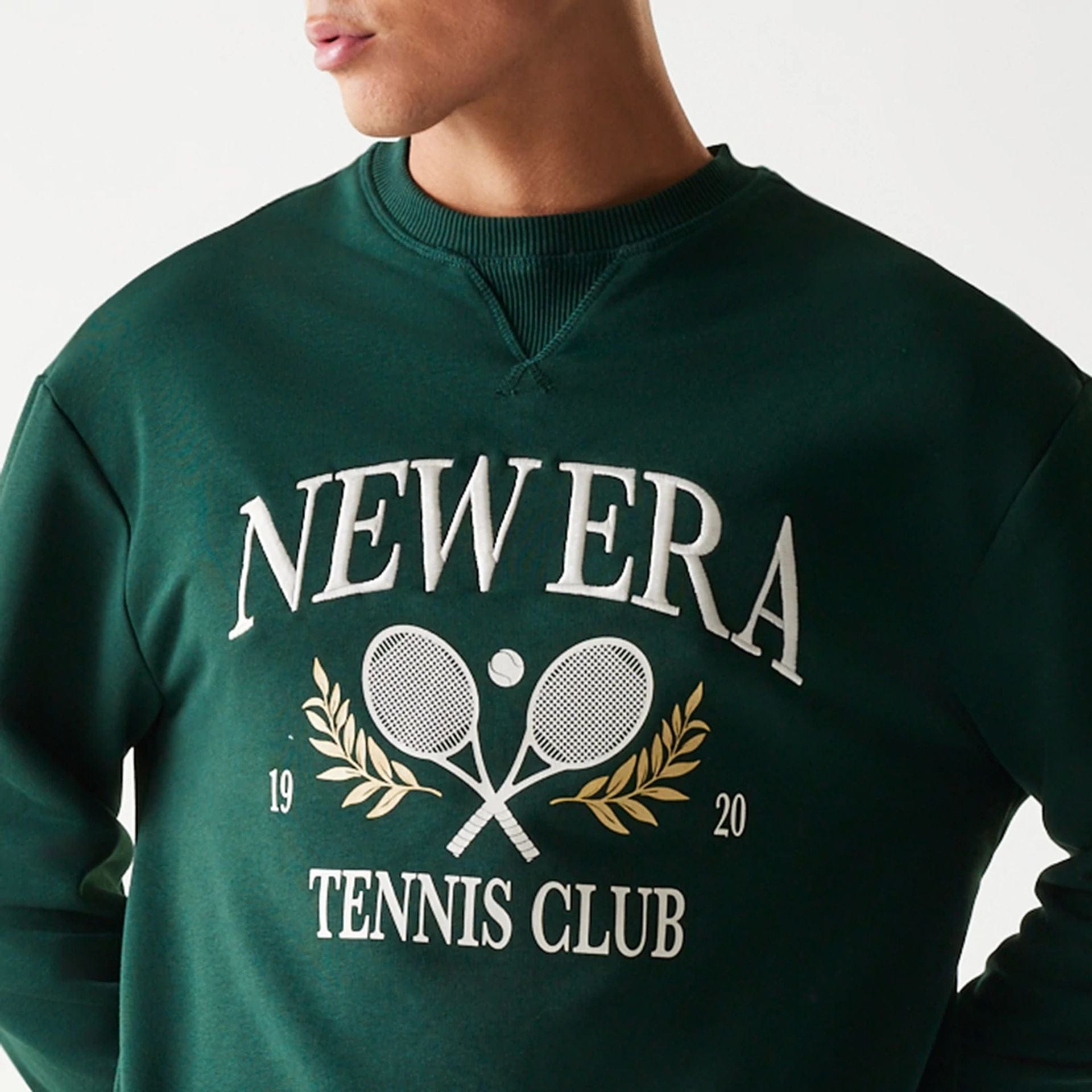 The Male model is wearing New Era Dark Green Oversized Crew Neck Sweater 6