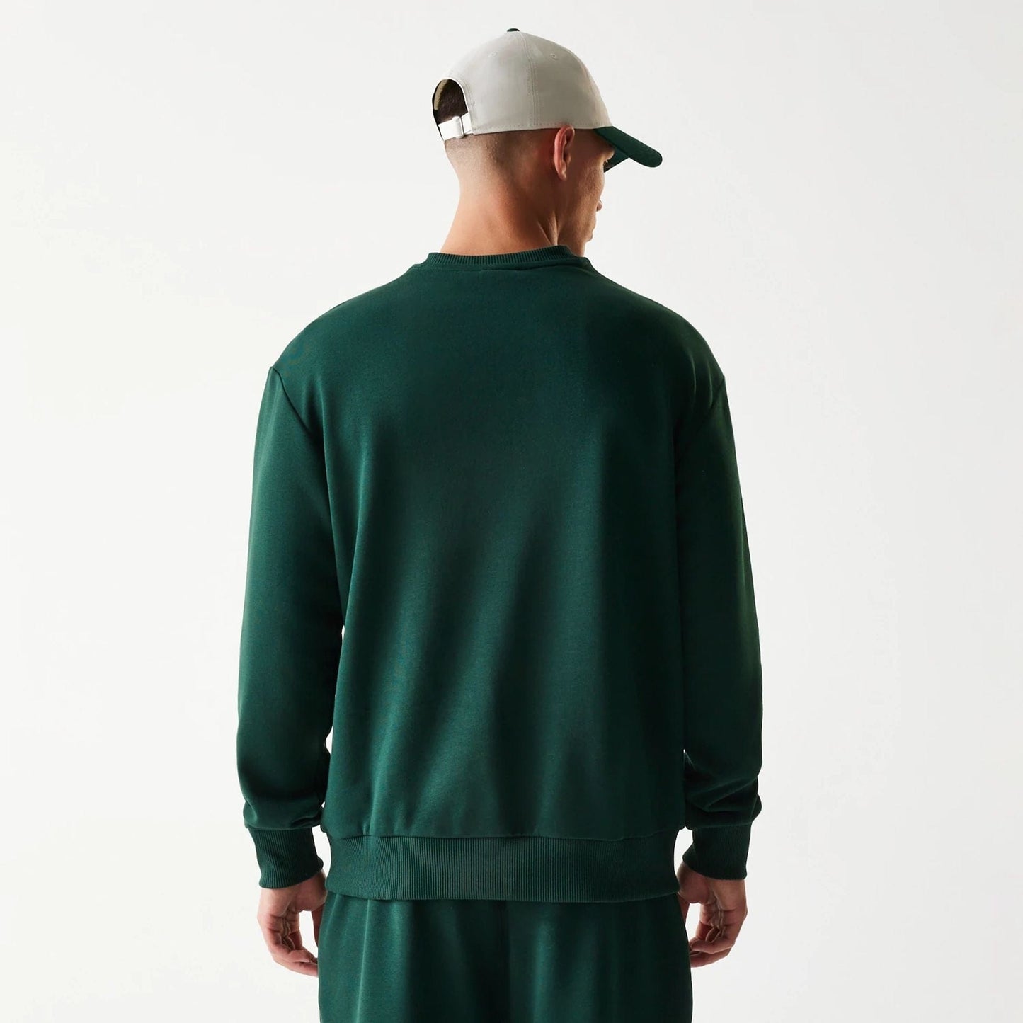 The Male model is wearing New Era Dark Green Oversized Crew Neck Sweater 2