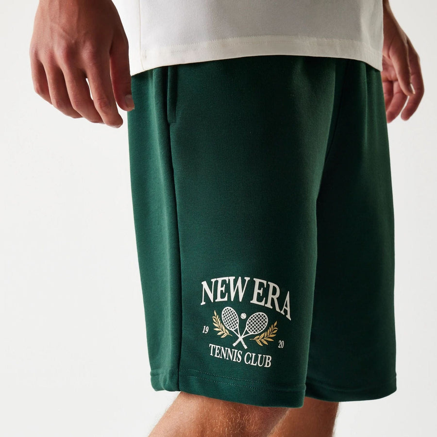 The Male model is wearing New Era Front Logo Dark Green Shorts 3