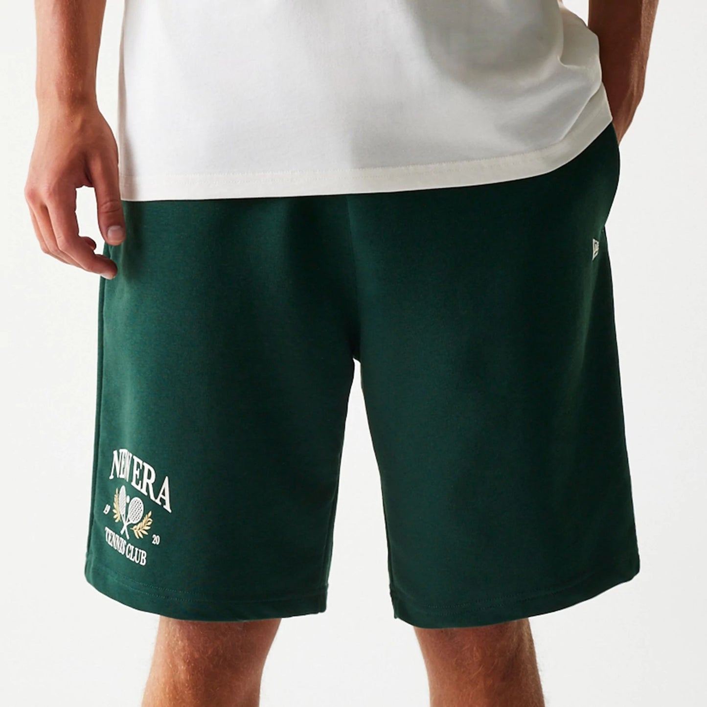 The Male model is wearing New Era Front Logo Dark Green Shorts 4